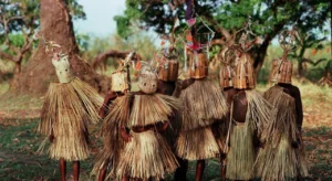 A group of Malawian initiates posing for a photo in full traditional Yao gear.