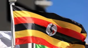 Ugandan flag hoisted on a mast