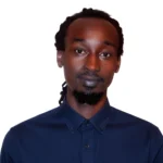 A portrait sized image of Allan Kimutai Tum in a blue shirt