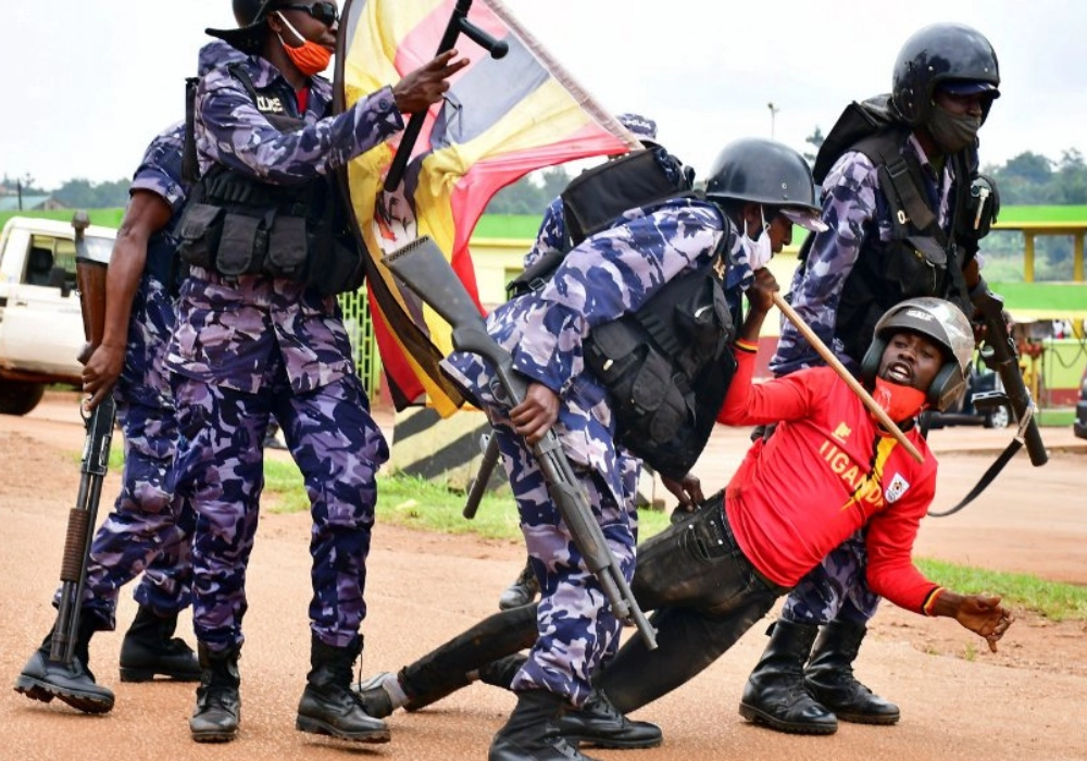 A man in Uganda being dragged by security forces