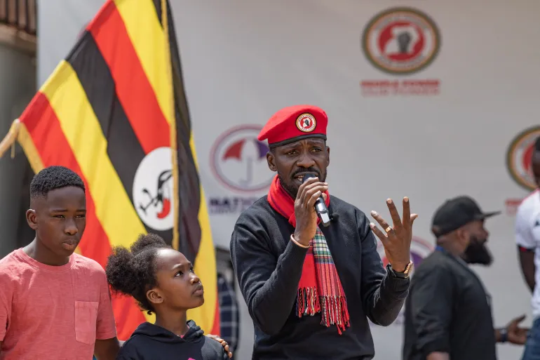 Ugandan opposition leader Bobi Wine gives a speech with his daughter Suubi and his son Shadrack Mbogo at the headquarters of his political party National Unity Platform (NUP) in Kampala on January 26, 2024